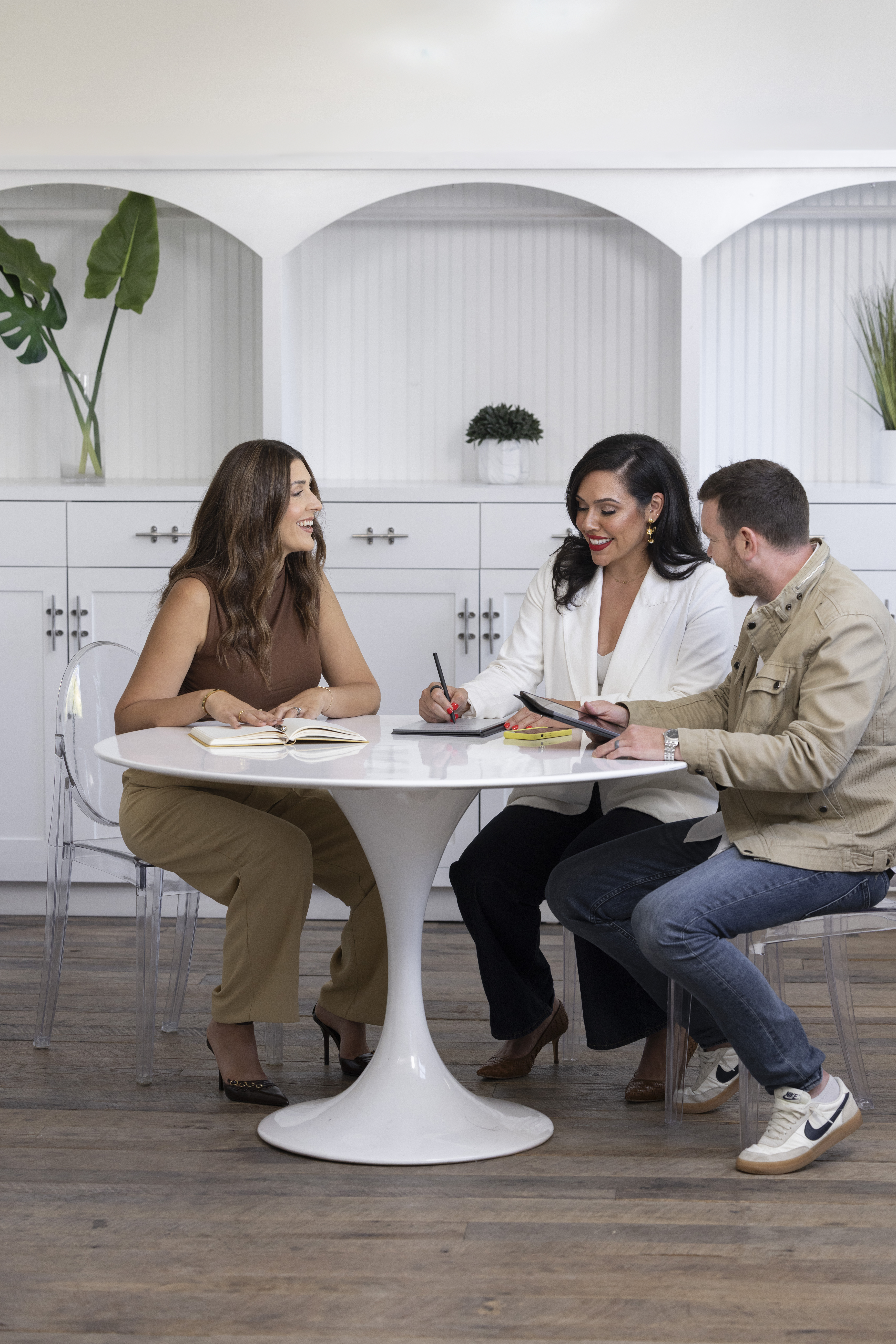 Kathy meeting with founders at a kitchen table